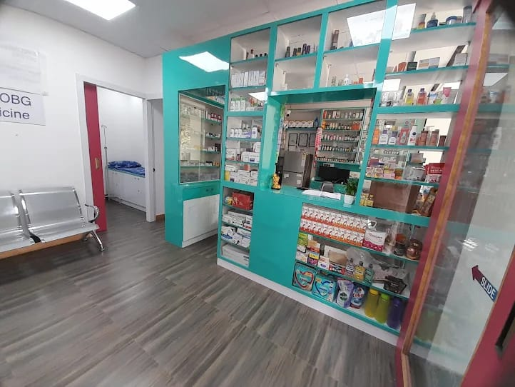 In-house pharmacy at Surecare Clinic, Yelahanka — shelves stocked with medicines and healthcare products